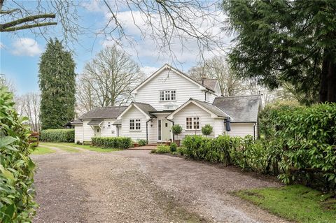 This beautifully presented four bed detached home is located in an Area of Outstanding Natural Beauty, in a peaceful rural location just on the outskirts of Handcross Village. The property is positioned in approximately 1.61 acres, with quadruple gar...