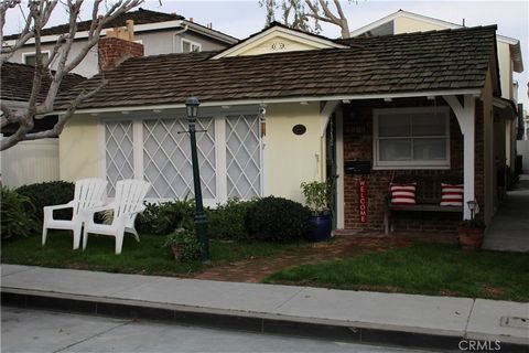 When you think of the quintessential Balboa Island cottage this 2 bedroom 1 bath front unit of this duplex is it! Plus there is a nicely remodeled 1 bedroom back unit above the garage too. The front unit has a dutch door that opens to an open beam ce...