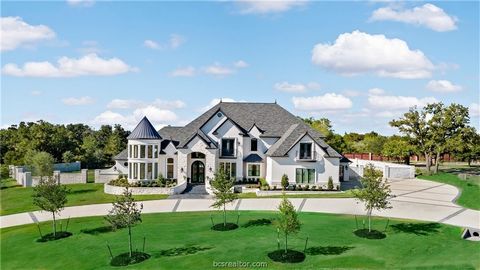 Opulence awaits in this commanding 5 bedroom/5.5 bathroom custom home located on 1.74 acres in Bryans Riverstone neighborhood.Walk into the welcoming grand foyer with marble flooring, viewing the ornate winding staircase with your large formal study ...