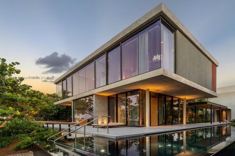 Step into a realm where luxury transcends imagination in this waterfront sanctuary that redefines zen living on the wide open bay. 6,081 SF oasis designed in collaboration with luminaries Andre Mellone, Raymond Jungles & Hoerr Schaudt is a haven of s...