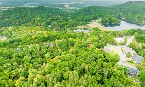 Check out this amazing lot to build your dream home on, it has access to beautiful lakes with unbelievable views! This property is a 1 minute walk to the 80 acre Lake Michelle with 360 degree views of the surrounding knobs. It features beautiful natu...