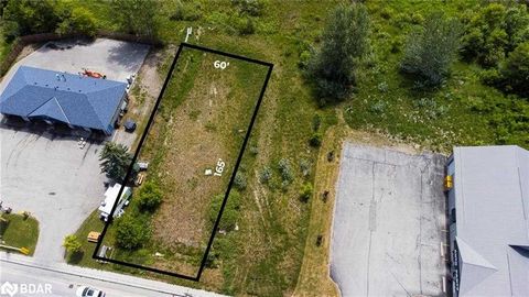 PRICE DROP! Located at the edge of the downtown core in the growing town of Elmvale, this lot is waiting for your dream business to be built. Highway Commercial (CH) zoning allows for numerous uses (see online Brochure link on Realtor.ca) such as a r...