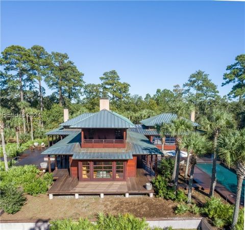Welcome to this stunning Japanese-inspired home located in the heart of the Lowcountry! Custom-built and situated on 56.1 acres of land within the highly sought-after community of Spring Island. This estate offers a deep water dock and marsh views th...