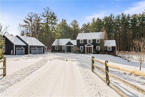 Discover the perfect blend of modern luxury and spacious living in Lakeville, Litchfield County. This exquisite property, nestled on over four acres, provides ample space for relaxation, entertainment, and enjoyment. It features a charming screened p...