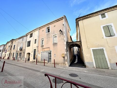Gard (30), for sale in the city center of La Calmette, exclusively, a building made of stone with a total surface area of 130m² composed of 2 lots, the real estate complex offers 1 commercial premises on the ground floor of 42m², 2 pieces. And an ind...