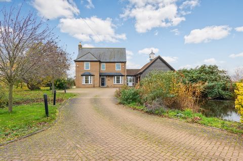Riverside Tranquillity: Immerse yourself in the serenity of an acre plot with panoramic views and versatile accommodation. Finished to an excellent standard, this bright residence spans three floors. Notably, the open-plan kitchen dining room and fam...
