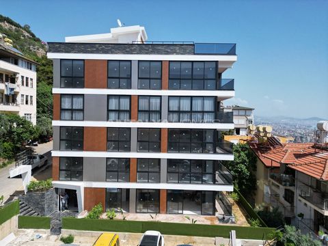 Key-Ready Sea-View Flats in a Complex with Pool in Alanya Küçükhasbahçe These key-ready flats include 2 or 3 bedrooms and a balcony. They are equipped with a satellite TV, steel entry door, shower cabin, PVC windows, sanitary systems, kitchen applian...