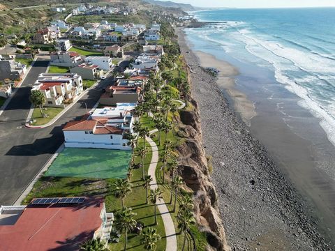 Oceanfront lot in the prestigious community Puerta del Mar Imagine starting each day with the rhythmic sound of waves and ending it with the breathtaking sunsets of Baja California, right from the comfort of your own home. Nestled within the prestigi...