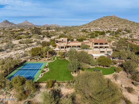 Enter a long private drive to this 6.6 ACRE compound in exclusive gated Canyon Heights. Situated on a flat parcel w/spectacular mountain + city light views, the 20,088 sf compound has 9 bedrms + 17 bathrms. It features 2 HOMES w /2 swimming pools, on...