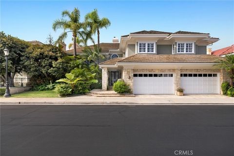 Welcome to 3 Weybridge, an exquisite custom estate nestled in the prestigious guard-gated community of Belcourt, located in the heart of Newport Beach. This grand residence spans approximately 6,500 square feet of luxurious living space, offering a s...