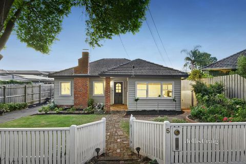 Beyond a charming weatherboard façade lies the beautifully renovated spaces of this captivating family home. Soaked in natural light and enhanced by timber floors, welcoming interiors flow from a spacious lounge warmed by an ambient fireplace, to a g...