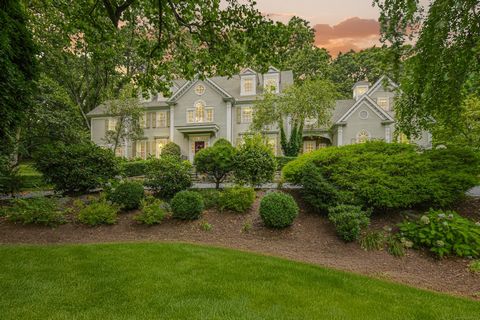 Beautifully sited at end of cul de sac w/ mature, lush landscaping, this quintessential New England Colonial offers the best in lifestyle living with 5 bedrooms and 5.2 baths. Enter into an oversize foyer with a graceful, sweeping staircase setting t...