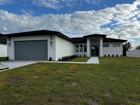 Welcome to your Brand new dream home! Located in the highly sought-after NW Cape Coral area. This stunning Charley Model by Sensational Homes, features 4 bedrooms and 2.5 baths, a blend of modern style and elegance. Beautiful, glass front doors shine...