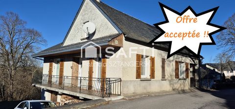 Maison T6 de 196 m² avec garages et jardin.