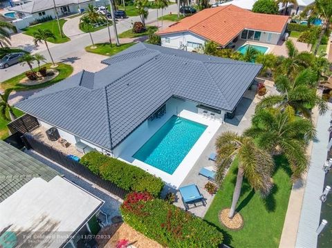 Picture Perfect RESORT-STYLE BEACH HOUSE w/ 80' of deep-water in sought after HARBOR VILLAGE!! Featuring a 20,000 lb boat lift 5 lots from the Intracoastal & MINUTES AWAY FROM THE INLET, the location is EVERY BOATERS DREAM! Designer finishes include ...
