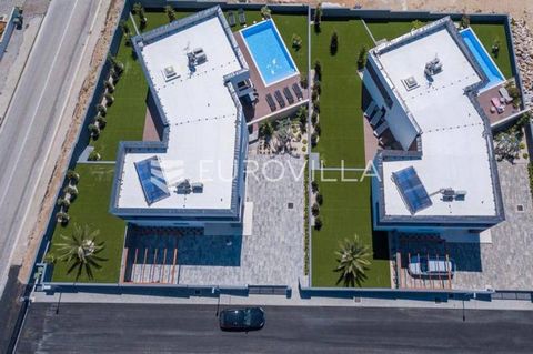 Novalja, two luxury villas categorized as 5* with a surface area of 350 m2 with yards of 650 m2, newly built in 2020, built on two floors within the resort. Ideal as an investment to continue a successful business. Ground floor: kitchen with dining r...