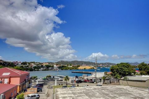 Great location and view. Schooner Bay two bedroom two bath second story condo with covered balcony overlooking Gallows Bay, Christiansted Harbor, Fort Christiansted, and the sea. The condo is fully furnished with an equipped kitchen. Split AC units i...