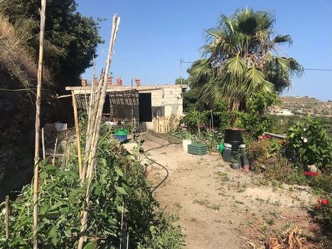 Partially built country house in Nerja of 70m2, 2,900 sq m of land, with electricity and water connected. It has 44 avocados, 28 mangoes, 2 custard apples, 2 orange trees, 1 lemon and some other fruit trees. It is located 11 minutes by car from the m...