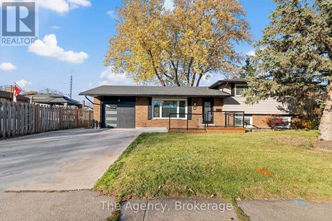 Updated side split home with all 4 levels completed. This family home is located in a desirable location near parks, schools and shopping near by. The updated main floor is open concept with large centre island with quartz counters and build In appli...