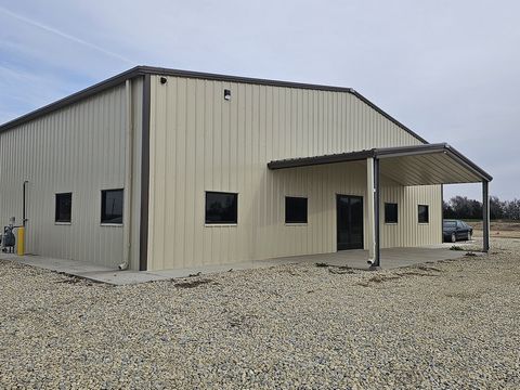 This is a great opportunity to own a nearly new, clean industrial shop on a large lot that includes frontage to Highway 56. The building measures 8400 square feet and includes 10 large overhead doors measuring 14 feet tall each and allowing pull-thro...