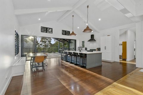Rarely do properties over 1 acre with 70 metres of river frontage become available, especially ones with expansive views of Murwillumbah's iconic mount Warning. This high set Queenslander is beautifully presented with a brand new extension and the or...
