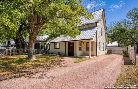A welcoming covered porch w/room for seating & leaded glass front door leads into bright entry & roomy living/dining combo, each w/charming beadboard accents. You'll love easy-to-care-for wood-look tile flooring throughout the main level & the classi...