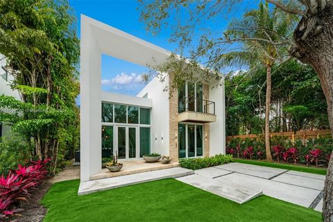 Nestled in the highly sought-after Mid-Beach neighborhood, this exquisite home seamlessly combines timeless elegance with modern design, offering the epitome of luxurious South Florida living. This contemporary 2-story residence, built in 2015 on a s...