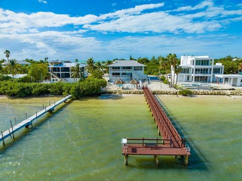 Sprawling Sombrero Beach retreat on an oversized lot, with pool, private sandy beach, and Open Water Views! Currently utilized as a successful vacation rental, this home boasts loads of space and elevated amenities for a family or income-producing in...