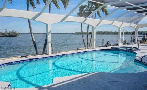 Direct Gulf Access Bayfront home with breathtaking views of Estero Bay Aquatic Preserve. Spacious open floorplan has been completely renovated. Step outside for a clear panoramic waterfront view from the Colonnade screened lanai with pool and spillov...