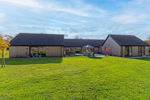 This beautifully finished, Scandinavian inspired single story home was designed and thoughtfully created by the current owner, offering luxurious living accommodation set on a gated plot approaching 1.2 acres, surrounded by rolling countryside. The p...