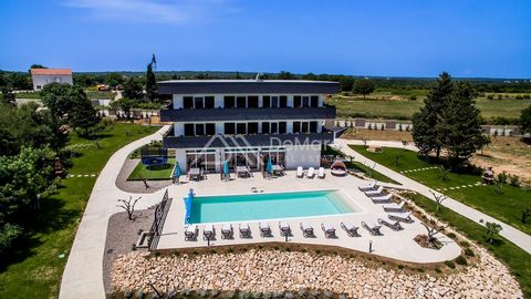 Newly built exclusive villa of 600 m2 in the surroundings of Zadar. The villa consists of 3 exclusive apartments and is located on a landscaped plot of 2660 m2. In front of the villa there is a heated swimming pool of size 14 x 5 m, and an area for r...