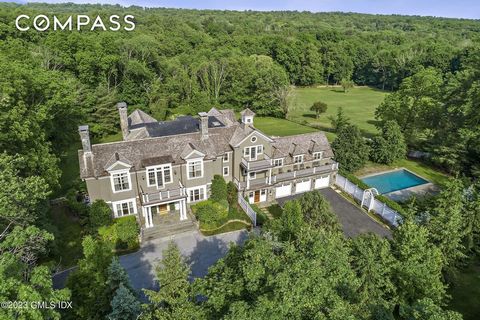 Elegant Round Hill Road Colonial with gated courtyard entrée to a private oasis. This superb Stone and Single home exudes warmth and luxury with generous living spaces that flow outdoors to a grand entertaining terrace, expansive yard with pool and s...