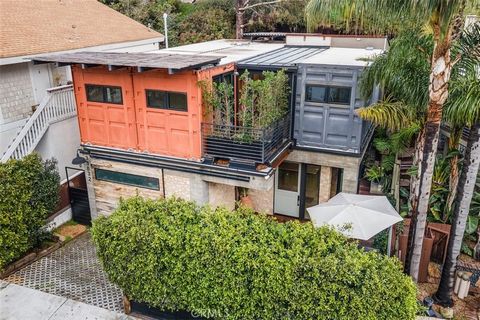 Nestled in the highly sought after Lantern District area of Dana Point, this extraordinary single-family home stands as a testament to innovative design and sustainable living. Crafted from repurposed shipping containers, the residence seamlessly ble...
