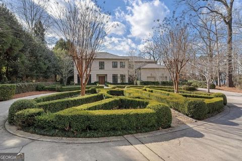 Beautifully designed custom home in Buckhead, situated on a private 1.11 -acre lot. This stunning modern-transitional residence was designed by architects, Harrison Design and finished in 2008. Built to last, this home features exterior insulated con...