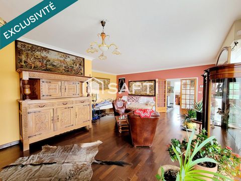 Maison traditionnelle T5 de 160m², trois chambres, dressing, véranda, terrasse avec vue, garage et atelier, jardin idéale pour une grande famille.
