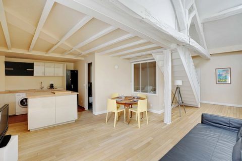 It is a 2-bedroom duplex apartment of 68m² located on the 5th floor (with elevator) of a Parisian building. It is composed of: - A pleasant living room with a sofa, and a TV - A dining area - An open and equipped kitchen (refrigerator with freezer sp...