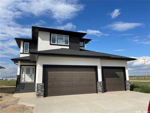 Ready to move in and located in the very desirable (and last phase!) of the Plains of Pilot Butte neighborhood. This home is 2012 sq. ft. developed with 3 bedrooms, 2.5 baths, a mudroom with custom lockers, a pass-through pantry, gourmet island kitch...