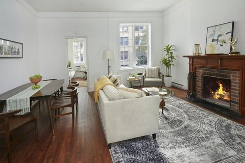 Exquisite full floor brownstone home invites you to enjoy, brilliant light through south, north and east exposures. Positioned on a pretty brownstone block this home has lovely views of the tree tops and the architecturally pleasing former Mannes Sch...