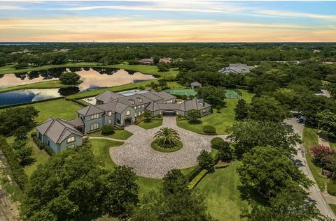 Privacy, Space & Views! Not another lot like this one inside Lake Nona Golf & Country Club! Over 2 acres, Main House, Guest House, Private Tennis Court, Private Pool & Personal Gym, all overlooking a glistening pond & the entire Par 3, Tee to Green, ...