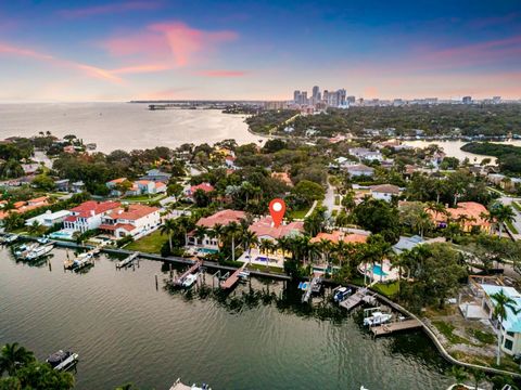 LOCATION IS EVERYTHING and this is your opportunity to own a luxurious 7029 square foot waterfront estate home on the most desirable street address in St. Petersburg, Brightwaters Blvd. Perfect for a large family living and working from home. This DE...