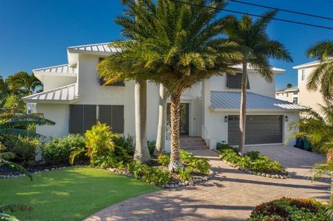Savor the Coastal Lifestyle in this Elevated, Whitehead Construction 4 bedroom/3.5 bath canal and golf course front home on Anna Maria Island's KEY ROYALE! This lovely, second owner home boasts vaulted ceilings, lofty windows, spacious and airy open ...