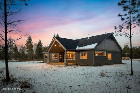 Live the North Idaho Dream in this Premier home on 20 acres with a 40 x 70 shop, two lean-tos and horse area. The dramatic great room welcomes you in with soaring ceilings and grand windows. There is room for everyone and plenty of space to entertain...