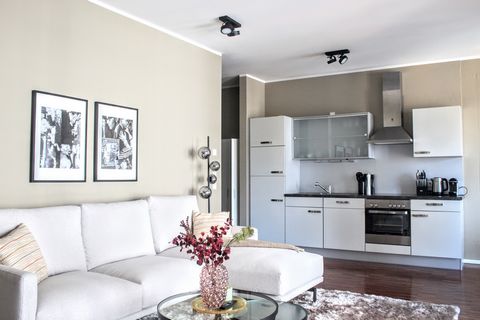 Experience comfort and style in this charming 2-room apartment. The cozy bedroom boasts a queen-size bed, and the modern open kitchen is fully equipped for all your culinary needs. Relax in the inviting living area that opens to a lovely balcony. The...