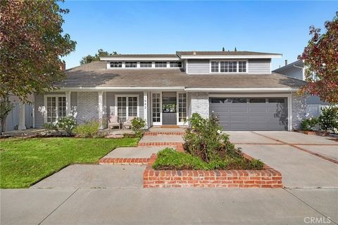 Discover a wonderful opportunity in the charming Harbor View Homes community, often referred to as the Port Streets of Newport Beach. This four-bedroom home is conveniently located near the peaceful community greenbelt. The inviting curb appeal featu...