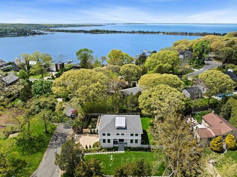 Welcome to this exquisite 5-bedroom, 6-bathroom home nestled in the sought-after Redwood waterfront neighborhood of Sag Harbor Village. The moment you arrive, the first thing that captures your attention is the white castle-like exterior of the resid...