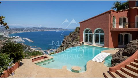 Facing the Bay of Cannes, on a hillside and out of sight, in the heart of the most sought-after gated estate in Théoule, this elegant, fully-renovated property offers exceptional views of the sea and the Estérel. The villa has 5 bedrooms and an offic...