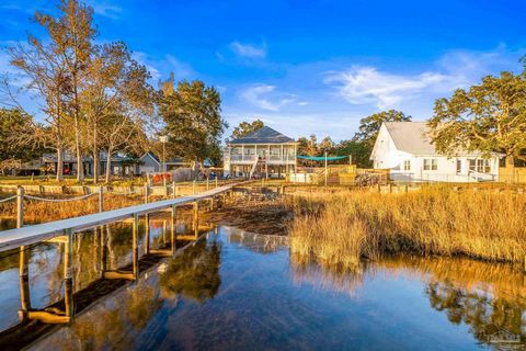 Discover your dream retreat with this stunning waterfront home offering 80' of pristine frontage on Blackwater Bay. Enjoy breathtaking views and amazing sunsets from the comfort of home or your outdoor living spaces, perfect for entertaining or relax...