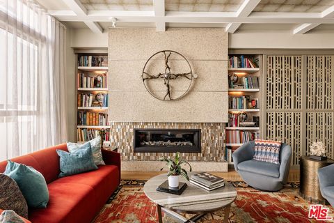 Tucked away on a private gated, brick-paved street, this radiant modern smart home offers both security and serenity in the heart of Hollywood's Media District.From your own oversized, EV-ready two-car garage with storage you step inside to discover ...