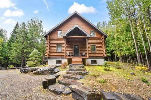 Here is a cottage in Mandeville (Lanaudière), located 90 minutes from Montreal. It is possible to make additional income through short-term rental. There are 3 bedrooms, 2 dens, 1 office, and 2 full bathrooms in this stunning log cabin. The large cen...