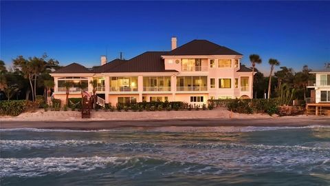 One or more photo(s) has been virtually staged. THE most iconic home on Manasota Key! A sprawling TWO+ ACRES on the BEACH and on the BAY, covering 196 feet of beach frontage, 243 feet of bay frontage, and an impressive 23 feet at the baseline elevati...